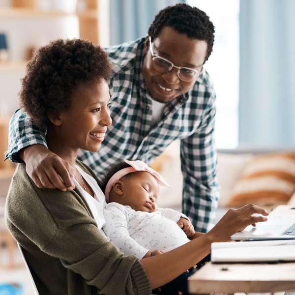 Family looking at laptop